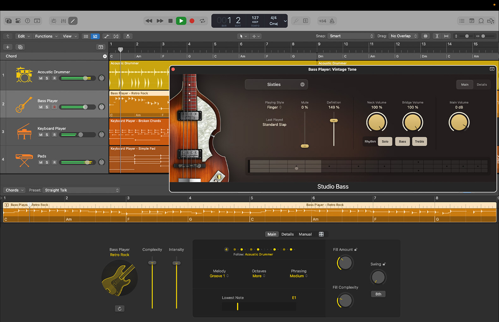 MacBook screen showing Logic Pro Session Players, highlighting the Bass Player with Vintage Tone